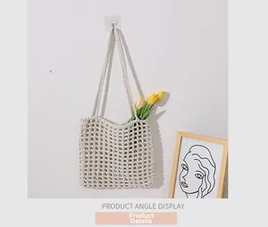 Detail showing the cream woven grid bag with cotton rope crochet texture and handle