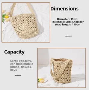 Detail view of woven straw bucket bag showing 19cm diameter and tassel decorations