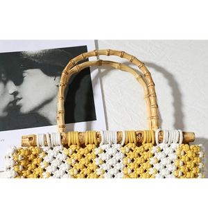 Handmade woven cotton rope handbag with diamond pattern and natural bamboo handles