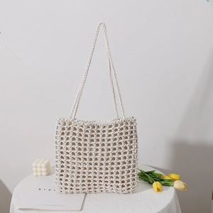 Handmade cream woven crochet shoulder bag with hollow mesh design and soft cotton ropes