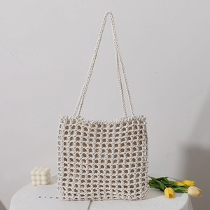 Handmade cream woven tote bag with large hollow grid design and soft shoulder straps