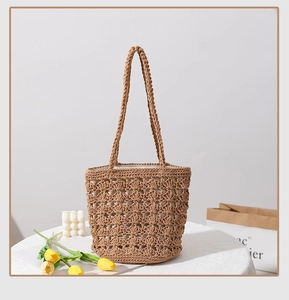 Detail of hollow hand-woven cotton thread beach bag with cream fabric lining and strap