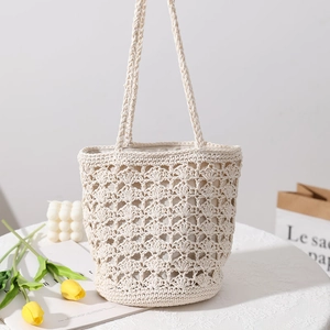 Handmade hollow crochet woven beach bag in cream white with dual handle design