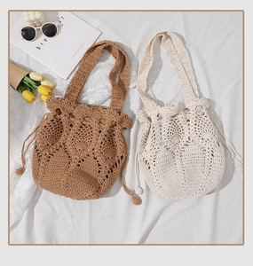 Detail of woven crochet bucket bags in coffee and beige with drawstrings and tulip decor