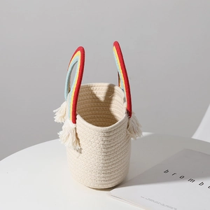 Handmade woven cotton tote with rainbow striped handles and fringe for beach vacations