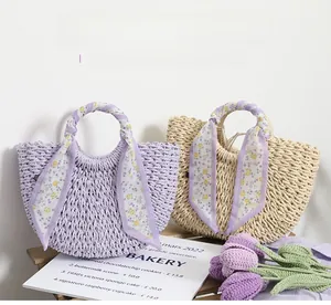 Close-up of woven straw bags with floral silk scarves on handles in lavender and beige