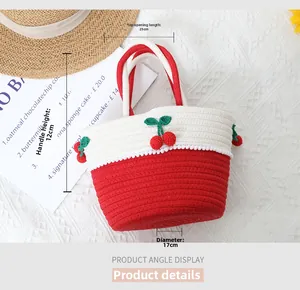 Detailed view of handmade woven cherry bag dimensions and red white cotton rope texture