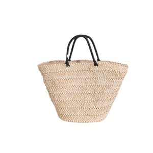 Minimalist straw woven beach tote bag with black rope handles and fabric lining