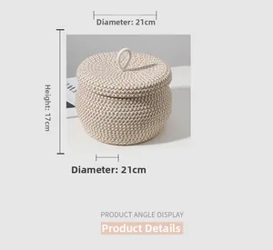 Detailed view of woven cotton rope storage basket with lid showing 21cm diameter size