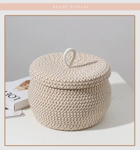 Macro detail of handwoven cotton rope storage basket with lid showing texture and handle