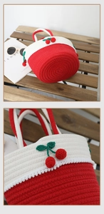Close-up of handmade crochet bag showing red cherry details and cotton weave texture