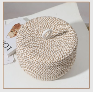 Close-up of hand-woven cotton rope storage basket with lid showing natural fiber textures