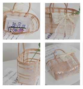 Close-up of pink straw bag with mesh texture and delicate cream lace ribbon bow