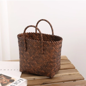 Retro dark brown woven straw tote bag with double handles and unique zigzag edge design