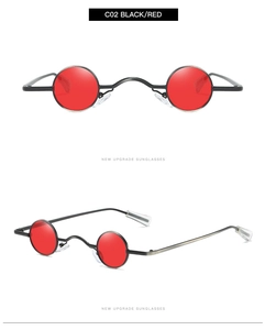 Close-up of retro punk sunglasses with small round metal frames and vibrant red lenses