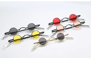Five pairs of vintage small round punk sunglasses with colorful lenses and metal frames