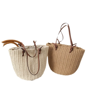Straw woven tote bags in beige and light brown with dark brown faux leather straps