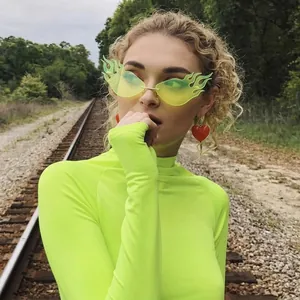 Trendy triangle cat eye flame sunglasses with neon yellow lenses and oversized frame