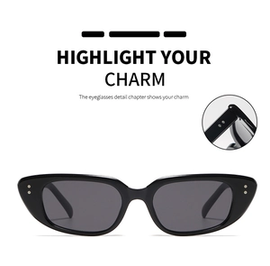 Detail of vintage cat-eye sunglasses with silver rivets and sleek black frames
