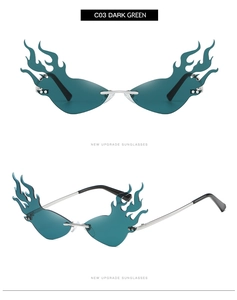 Detail view of silver flame frame sunglasses with dark green lenses and black temples