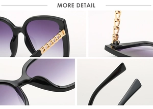Dettaglio occhiali da sole cat-eye con lenti sfumate viola e stanghette a catena dorata
