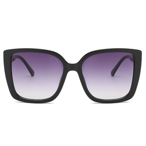 Occhiali da sole cat-eye vintage con montatura nera e lenti viola sfumate