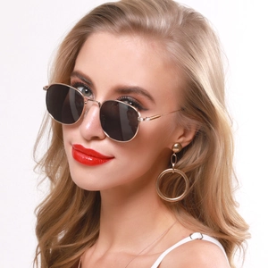Retro small square metal sunglasses with grey lenses and matching gold hoop earrings