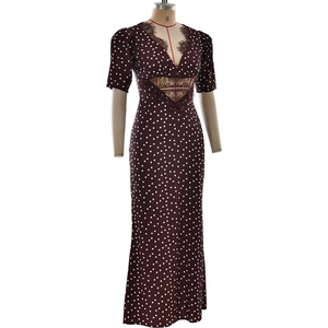 Detail of V-neckline with black eyelash lace trim on brown polka dot maxi dress