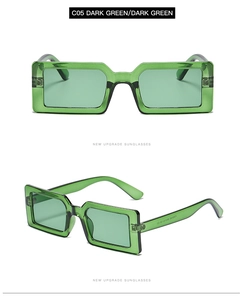 Detail view of small rectangular dark green sunglasses with polished thick frames