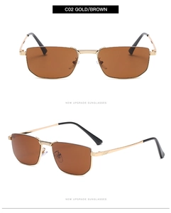 Detail of gold metal semi-rimless sunglasses with brown lenses and nose pads
