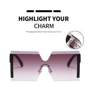 Detail showing the sturdy metal hinge and wide black temples of the gradient sunglasses