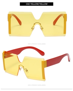 Detail view of yellow oversized rimless sunglasses with gradient lenses and red temples