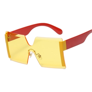 Oversized rimless sunglasses with yellow gradient lenses and red temples for streetwear