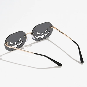Halloween pumpkin face rimless sunglasses with gold metal temples and grey lenses