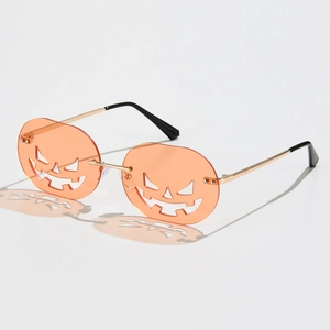 Halloween pumpkin sunglasses with orange hollow-out lenses and gold metal frame