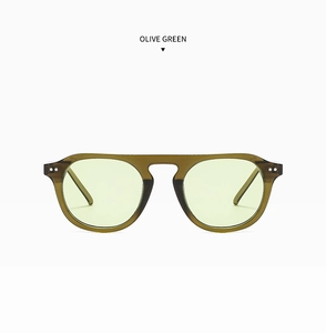 Detail of olive green pilot sunglasses with silver metal rivets and translucent frame