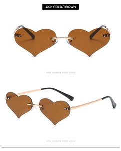 Detail of heart flame sunglasses with gold metal frames and brown lenses S2091