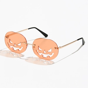 Halloween pumpkin sunglasses with orange frameless jack-o'-lantern cutout lenses and gold metal arms