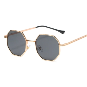 Vintage octagonal sunglasses with gold metal frame and dark grey lenses for a retro look