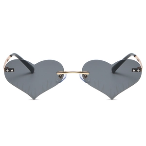 Fashion heart shaped flame sunglasses with gold metal bridge and dark grey rimless lenses
