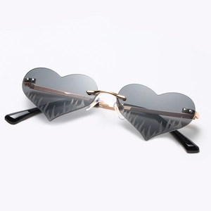 Frameless heart shaped flame sunglasses with grey lenses and gold metal temples for women