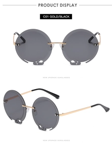 Makroaufnahme einer runden Gold-Sonnenbrille mit einzigartigem Hohlglas-Design