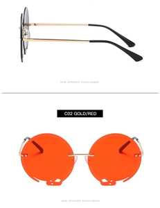 Detail einer runden randlosen Sonnenbrille mit goldenen Metallbügeln und Cut-out-Linsen