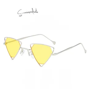 Detail showing the thin silver metal hollow frame and yellow lenses of these punk sunglasses