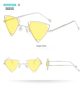 Detail view of silver triangle sunglasses with yellow lenses and hollow metal frame
