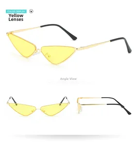 Détails de lunettes de soleil œil-de-chat à monture dorée avec des verres jaunes tendance
