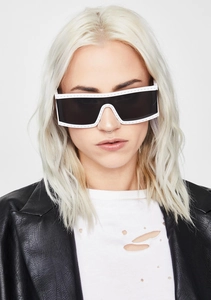 Close-up of punk style white rectangle sunglasses with metallic studs on a model