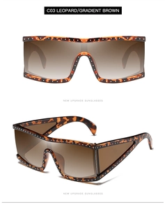 Detail view of leopard print shield sunglasses with decorative silver metal rivets