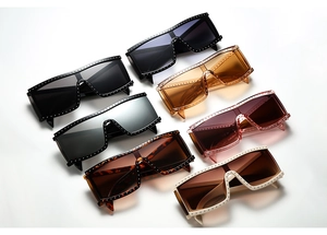 Detail shot of oversized square punk sunglasses with metal rivet trim in seven colors
