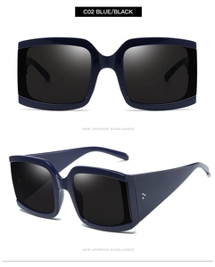 Vue détaillée de lunettes de soleil vintage carrées avec rivets en métal et monture bleue